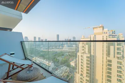 a view of the city from the top of a building at Modern Brand New 1BR Luxury Apartment With Cozy Interiors In Jumeirah Village Circle in Dubai