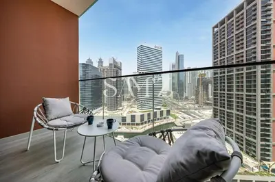 a balcony with a view of a city skyline at Chic Studio Unit 1808 Peninsula Five in Sabkhah