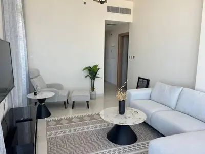 a living room with a couch and a table at 1BR Amazing Dubai And Sea View in Dubai