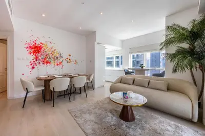 a living room with a couch and a table at Modern Luxury Marina Stay with Ain Dubai View - Near JBR Beach in Dubai