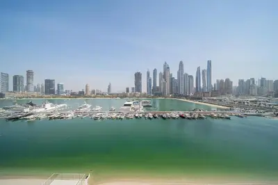 an aerial view of a harbor with boats in the water at Modern 2BR Retreat with Stunning Sea Views in Dubai