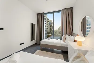 a hotel room with two beds and a large window at FIRST CLASS 2BR Luxury Hideaway in Dubai
