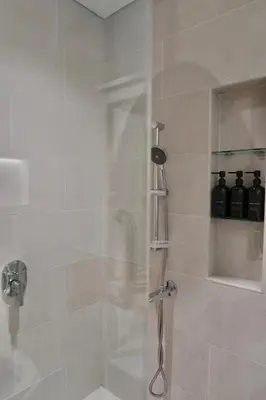 a shower with a glass door in a bathroom at Madinat Jumeirah Living in Dubai