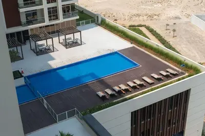 an overhead view of a swimming pool in a building at FIRST CLASS Studio Chic and Comfy in Jewelz in Dubai