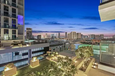 a view of a city skyline at night from a building at FIRST CLASS 1BR Elegant Living with City Views in Dubai