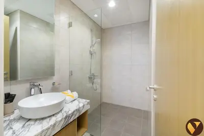 a white bathroom with a sink and a shower at Vogue Business Bay Aykon City Tower Close to Downtown Burj Khalifa and Dubai Mall, Two Bedroom Apartment with Large Balcony Sea view, Access to all Amenities in Dubai