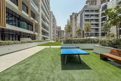 a ping pong table in the middle of a building at Airstay - Modern 1BR - Pool Views - Azizi 61 - Monthly Offer Available in Dubai
