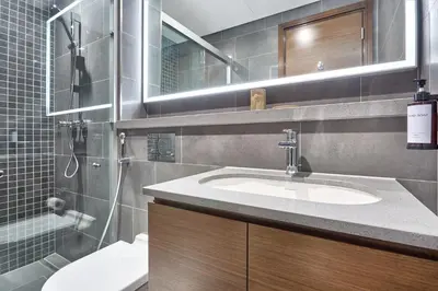a bathroom with a sink and a shower at STAY BY LATINEM Luxury 2BR Holiday Home CB 1313 Near Burj Khalifa in Dubai