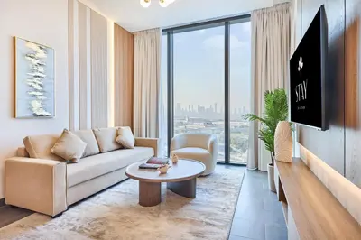 a living room with a couch and a table at STAY BY LATINEM Luxury 2BR Holiday Home CB 1313 Near Burj Khalifa in Dubai
