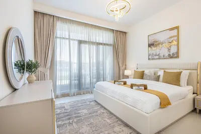 a bedroom with a large bed and a large window at Luxe 6BR Semi-Detached Villa Steps from the Lagoon in Dubai