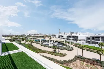 an aerial view of the courtyard of a building at Luxe 6BR Semi-Detached Villa Steps from the Lagoon in Dubai