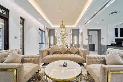a living room with couches and a table at FAM Living - 2 Bedroom Old Town Dubai Stay in Dubai