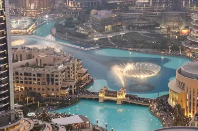an aerial view of a city at night at Unobstructed Burj Fountain View Near Dubai Mall in Dubai