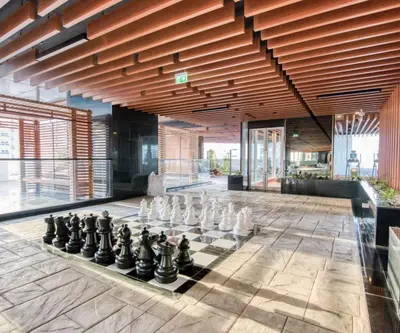 a chess board on the floor of a building at Burj View 1BHK near Down Town - Panoramic Balcony View -Pool and Gym in Dubai