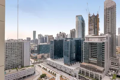 an aerial view of a city with tall buildings at Waves - Modern City Escape 1BR Apt With Balcony in Dubai