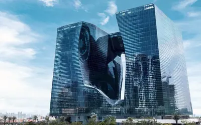 a large glass building with a large object on it at The Opus residences 1 bedroom city view in Dubai