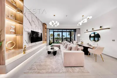 a living room with a couch and a table at Vida Residences The Hills, Dubai in Dubai
