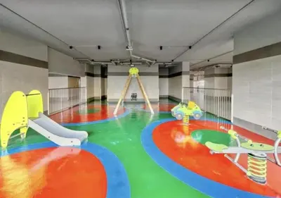 a large room with a play room with a playground at FIRST CLASS Studio Cozy with City Vibes in Dubai