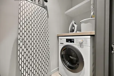 a laundry room with a washer and dryer at Prestigious 2BD Seaside Apartment, The Address JBR in Dubai