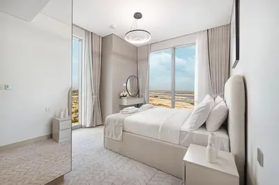 a bedroom with a large bed and a large window at Vida Dubai Mall! Excellent Amenities, Mall Connected! in Dubai