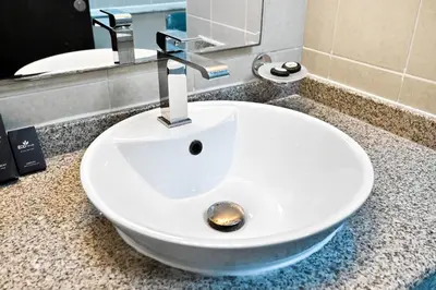 a bathroom sink with a faucet on a counter at Torch Dubai Marina 2BDR with Pool Gym and Views in Dubai