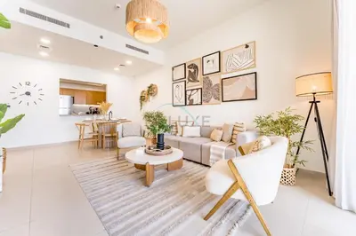 a living room with a couch and a table at Iconic Burj Khalifa View 2BR with Assistant Room, Steps from Dubai Mall and Beside a Park, Bellevue Towers 1, Downtown Dubai by Deluxe Holiday Homes in Dubai