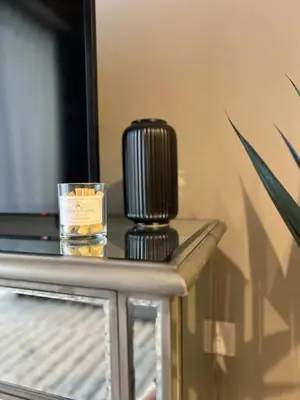 a candle sitting on top of a table at Cozy 1BR in Zada Tower Business Bay in Dubai