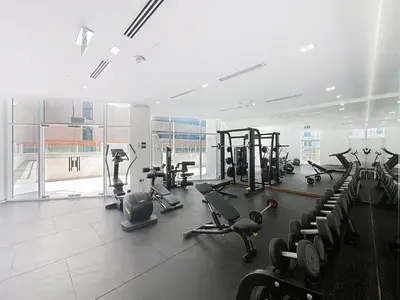 a gym with treadmills and cardio equipment in a building at Vacationer l 1 Bedroom Perched on the 19th Floor l Free Pool, Gym Access in Dubai