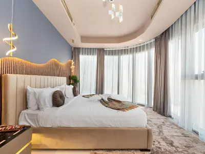 a bedroom with a large bed and a large window at ElysianSky Burj Khalifa Views 3 Bedroom Apartment at Paramount Hotel Midtown with 64th Floor Rooftop Pool in Dubai