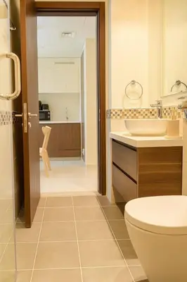 a bathroom with a toilet and a sink at Modern 1BR Near Burj Khalifa Business Bay Reva Apt in Dubai
