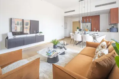 a living room with a couch and a table at Frank Porter - La Sirene, Jumeirah in Dubai