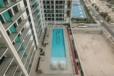 an overhead view of a swimming pool in a building at FIRST CLASS Studio Cozy Hideaway in Dubai