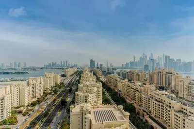 an aerial view of a city with tall buildings at Daniels 1BR with Sea View at The Palm Tower in Dubai