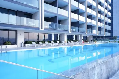 an image of a swimming pool in a building at Luxury Trillionaire Studio with Jacuzzi and Canal Views in Business Bay in Dubai