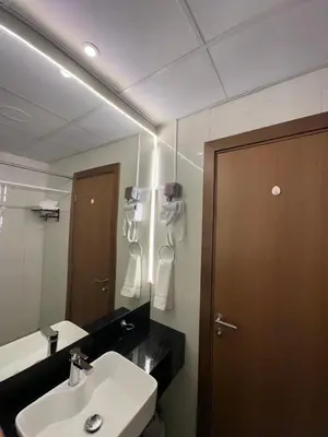 a bathroom with a sink and a mirror at Livincci - Luxury Studio Burj Khalifa View - 12 in Dubai