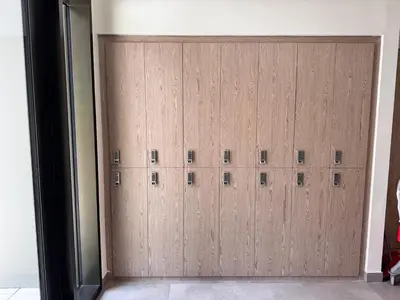 a wooden garage door with a bunch of lockers at Elegant Studio in Peninsula One, Business Bay in Dubai