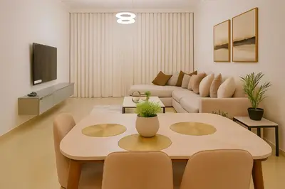 a living room with a table and a couch at Sunset Beach Escape at Palm Jumeirah 2BR 241 by The Rosewood Vacation Homes Rental LLC in Dubai
