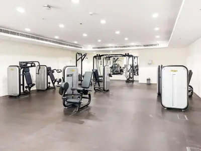a gym with several treadmills and exercise bikes at Duja Tower 4114 in Dubai
