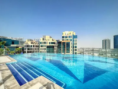 a large swimming pool on top of a building at Studio in downtown of Dubai in Dubai
