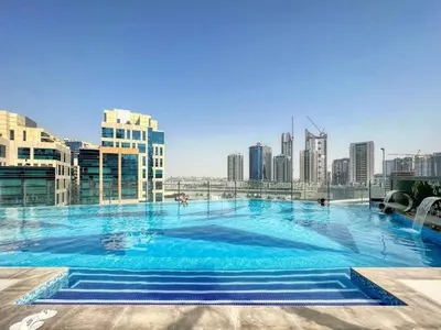 a large swimming pool on top of a building at Studio in downtown of Dubai in Dubai