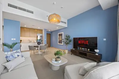 a living room with a couch and a tv at Luxury Seaview Apartment Near Bluewaters & JBR in Dubai