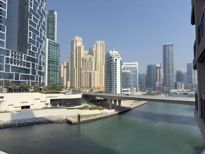 a view of a river in a city with tall buildings at Luxury Seaview Apartment Near Bluewaters & JBR in Dubai