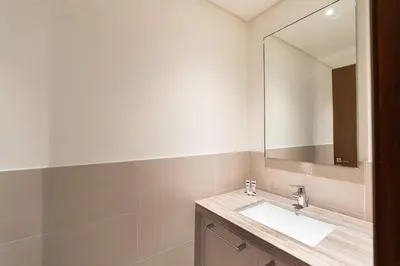 a bathroom with a sink and a mirror at PVH - Vibrant 1BR near Dubai Opera - BLVD Heights in Dubai