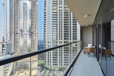 a balcony with a view of a large city at FAM Living - 2 Bedroom Aykon City Dubai in Dubai