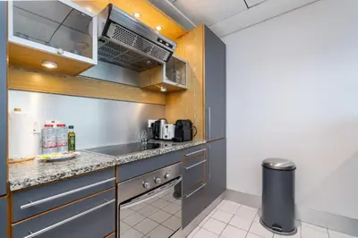 a small kitchen with a sink and a microwave at Spacious 2 Bedroom plus Office Prime Dubai Marina in Dubai