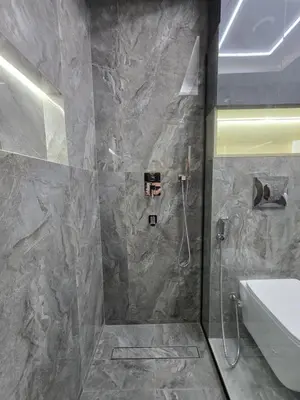 a bathroom with a shower with a toilet and a sink at Luxury Studio in JLT near Metro & Lake View in Dubai