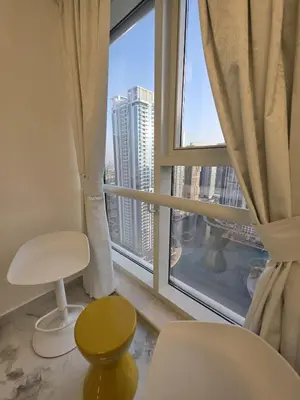 a room with a window with a view of a city at Luxury Studio in JLT near Metro & Lake View in Dubai