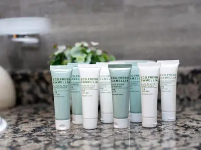 a group of four cups of moisturizers on a counter at Luxurious 2BHK Sea & Dubai Eye View in Dubai