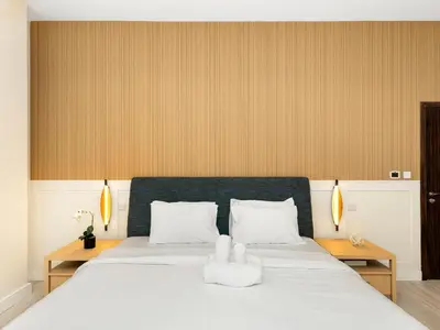 a bedroom with a bed with two towels on it at Luxurious 2BHK Sea & Dubai Eye View in Dubai