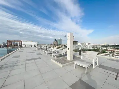 a row of white chairs sitting on top of a roof at Dubai heaven in Dubai